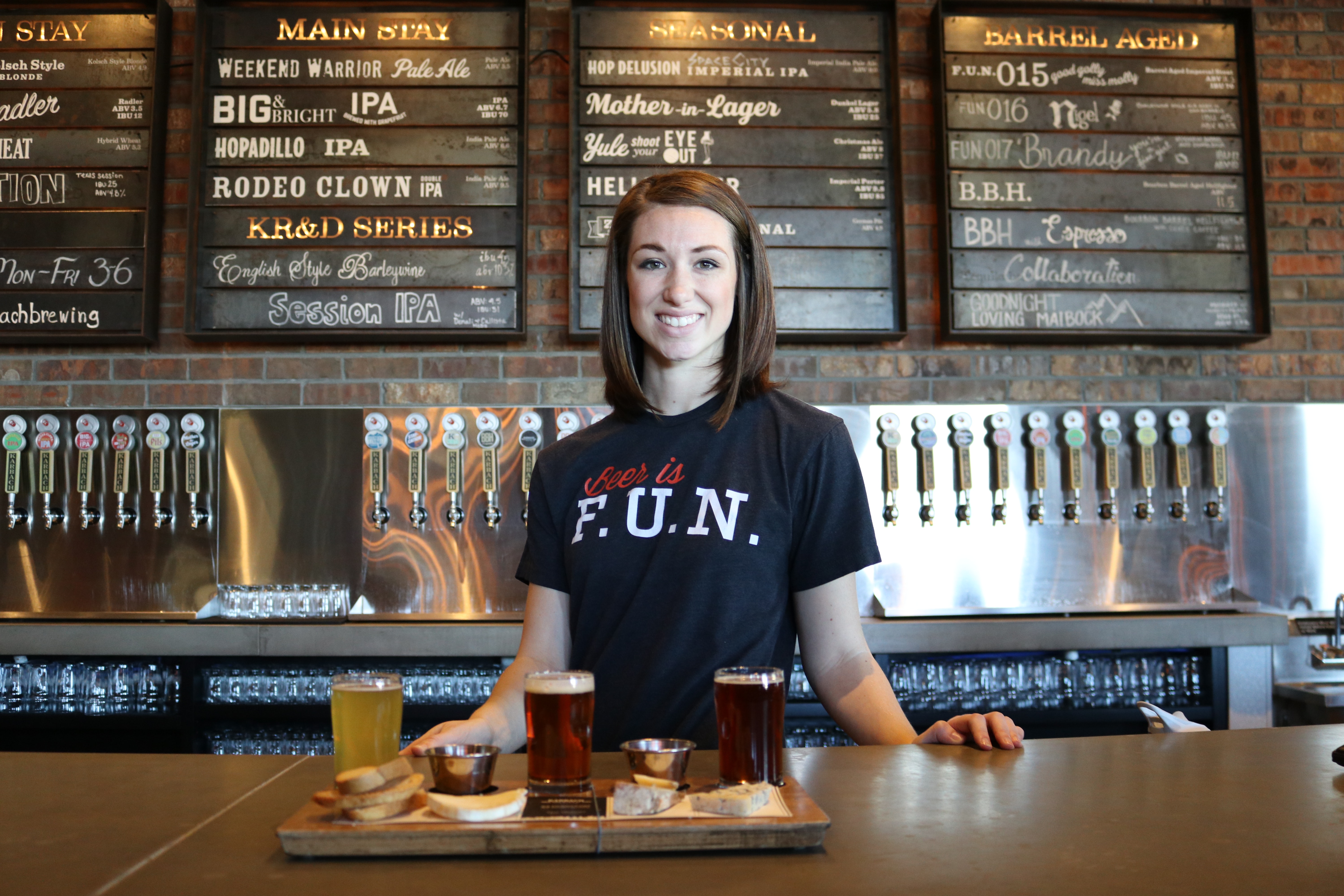 female bartender with food and drinks